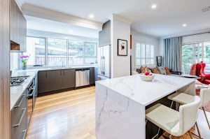 a kitchen and living room with a large island