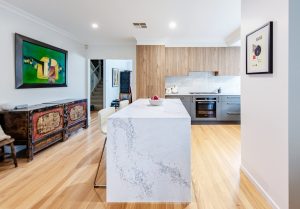 a kitchen with a marble island