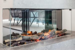 a fireplace with wood burning in it
