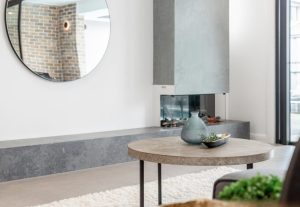a round mirror above a table