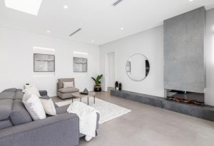 a living room with a fireplace and a couch
