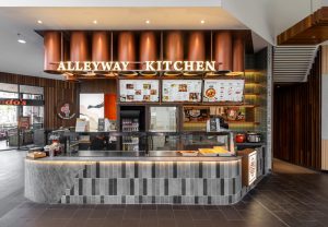 a restaurant with a counter and menus