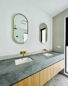 a bathroom with two sinks and mirrors