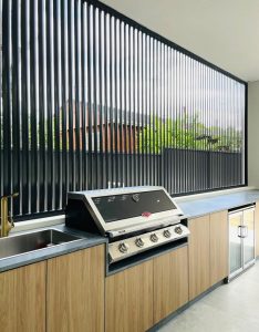 a kitchen with a grill and sink