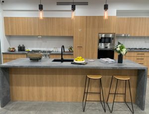 a kitchen with a counter top and stools