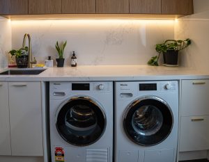 a washing machine and dryer in a kitchen