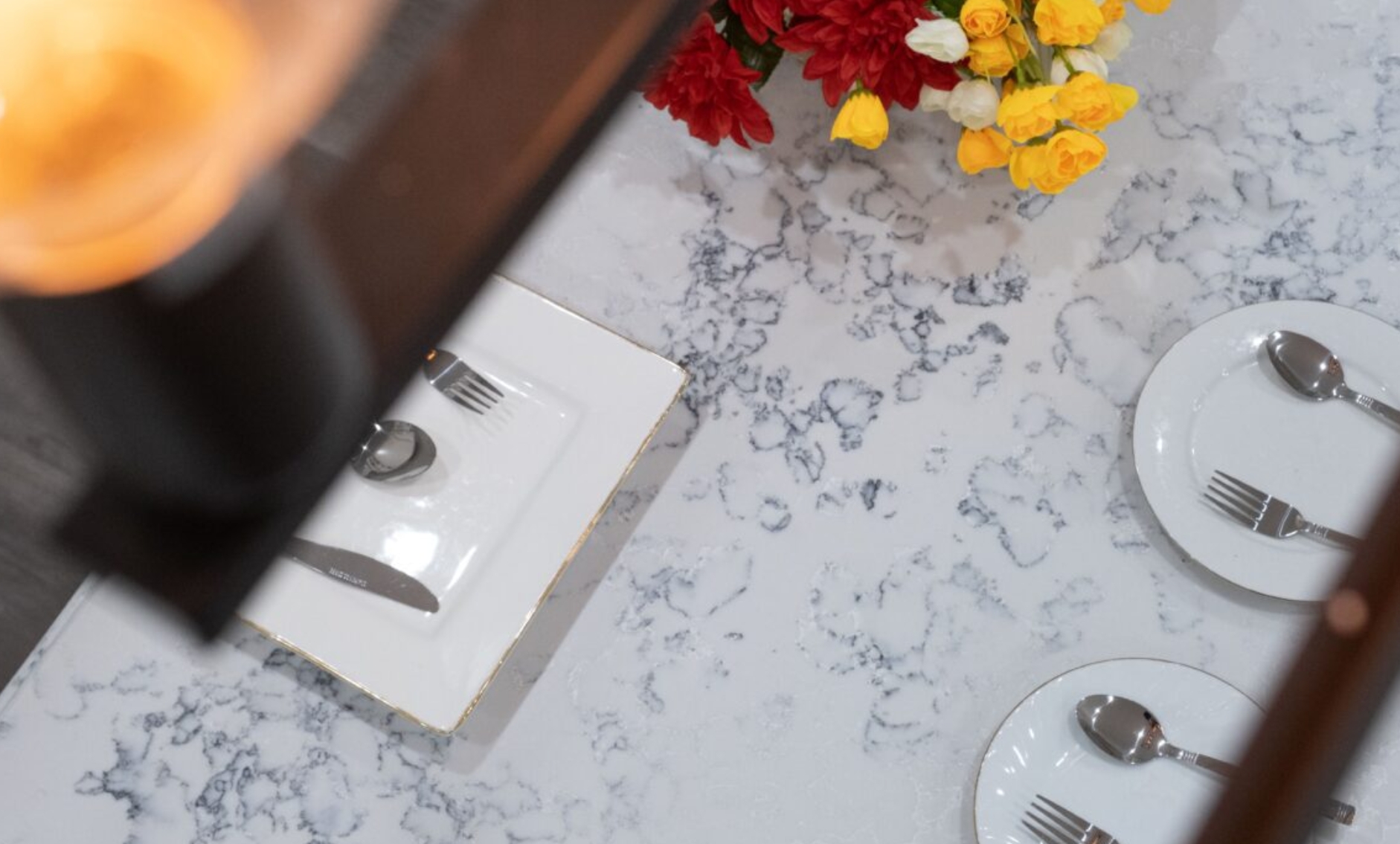 Snowy Mountain (AC8000)3 a plate with silverware and a bouquet of flowers on a marble table