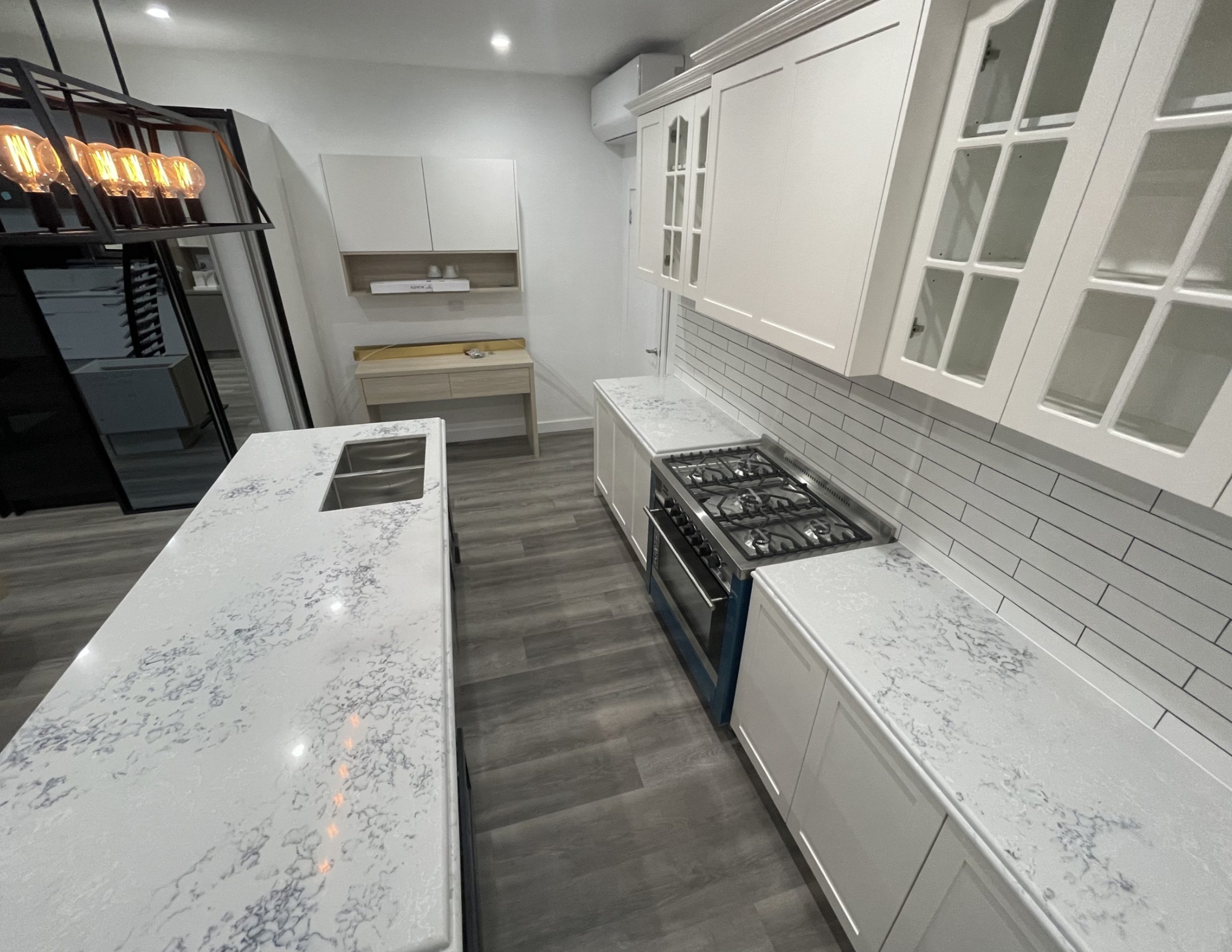 Snowy Mountain (AC8000)8 a kitchen with white cabinets and counter tops