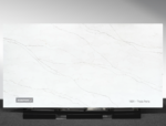 Vicostone Theia Perla 1601 quartz slab soft white surface with warm flowing veins close-up