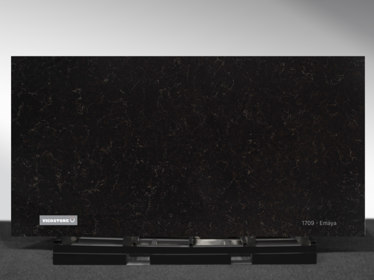 Vicostone Emaya 1709 quartz slab deep black surface with delicate short veins close-up