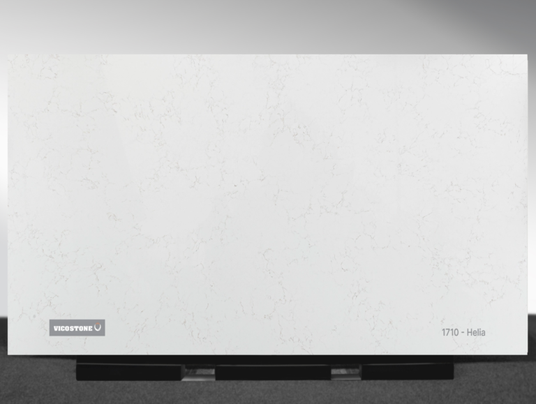 Vicostone Helia 1710 quartz slab white surface with gold and gray veins close-up