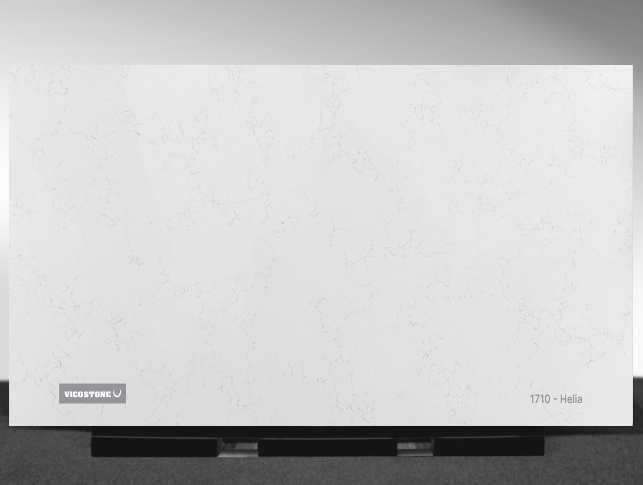 1710 Helia Vicostone Helia 1710 quartz slab white surface with gold and gray veins close-up