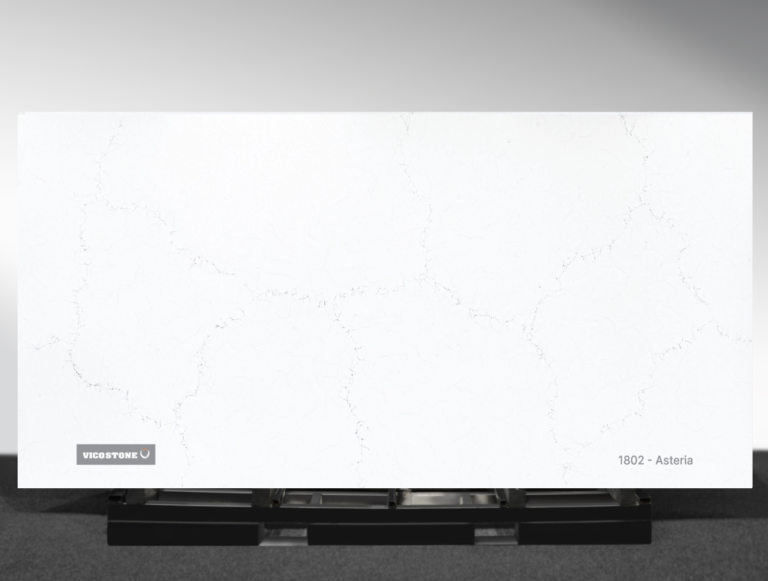 Vicostone Asteria 1802 quartz slab white surface with delicate flowing veins close-up