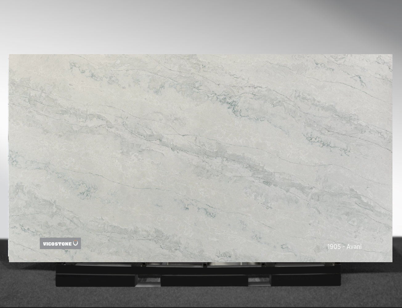 Avani Vicostone Avani 1905 quartz slab dark earthy surface with dynamic flowing patterns close-up