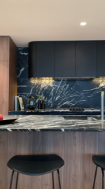 Black Caviar Marble kitchen benchtop with dramatic natural veining in modern interior design