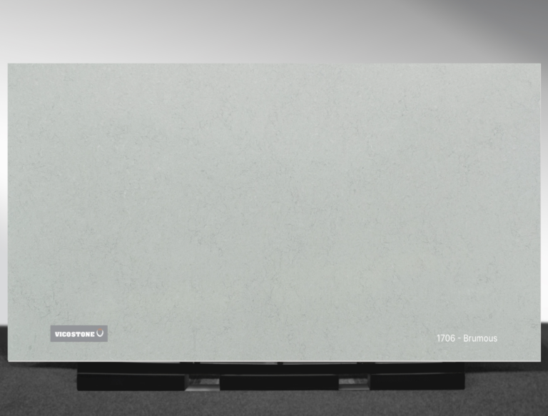 Vicostone Brumous 1706 quartz slab cool gray surface with dark veins close-up
