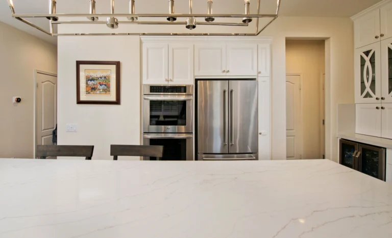 Calacatta Dorada Vadara® Quartz engineered stone slab with white background and wispy taupe veining