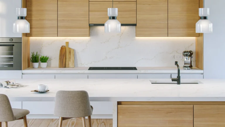 Gossamer Sands Vadara® Quartz engineered stone slab with bright white background and light brown veins