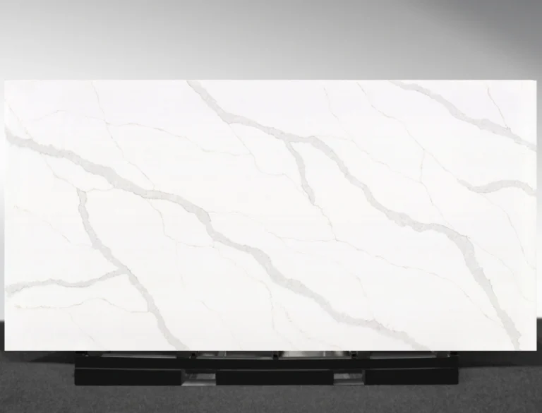 Close‑up of Lakestone Vadara® Quartz highlighting dynamic grey and rust veins