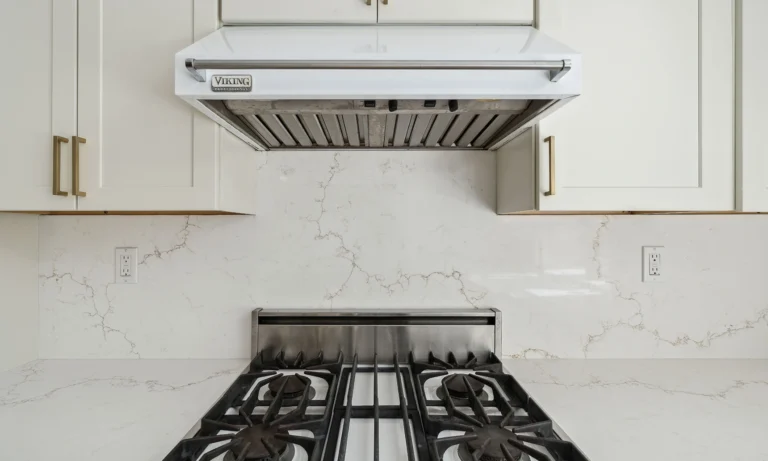 Sand Weaver Vadara® Quartz engineered stone slab with bright white background and flowing gold veining