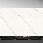 Sinterra Vadara® Quartz engineered stone slab with off‑white and soft grey base and muted gold veining
