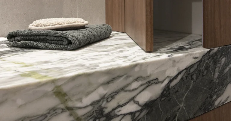 Calacatta Jade marble offcut with white base and green veining in Sydney showroom