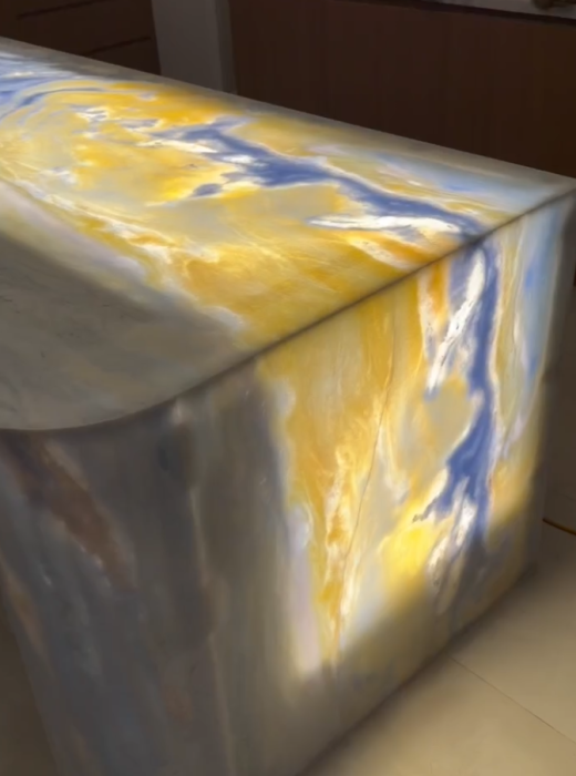 Backlit Blue Crystal quartzite stone island glowing under LED lighting, showcasing translucent natural quartzite texture, luxury kitchen installation in Sydney by AUSKstone.